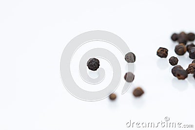 Closeup dried black pepper on white background Stock Photo