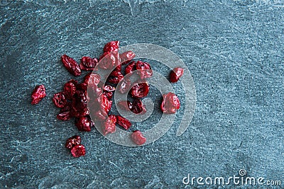 Closeup on dried lingonberries on stone substrate Stock Photo