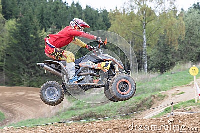 Closeup dynamic shot of quad rider jumping Editorial Stock Photo