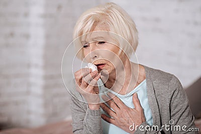 Closeup of elderly coughing woman Stock Photo