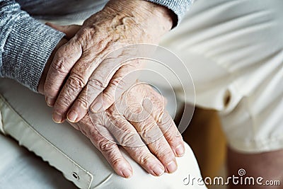 Closeup of elderly hands putting together Stock Photo