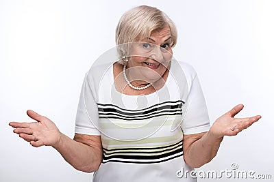 Closeup of elderly woman shrugging shoulders Stock Photo