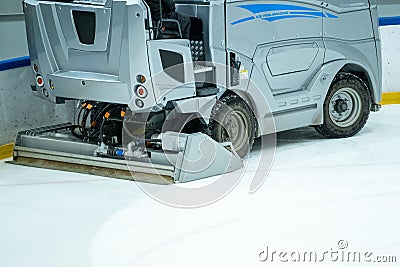 Closeup of an electric operated Ice resurfacer machine cleaning the ice surface Stock Photo