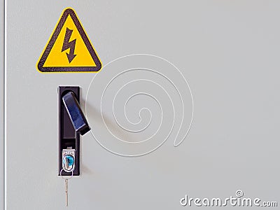 Closeup of electrocution hazard icon sticker on power panel door Stock Photo