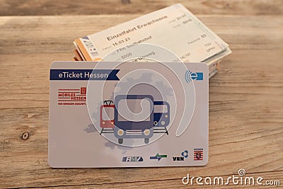 closeup electronic eTicket on table, monthly train, bus travel passes in germany for public transport, travel concept, Editorial Stock Photo