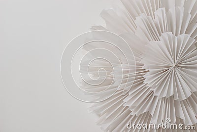 Closeup of elegant paper decoration, garlands for party, new year, bachelorette, birthday or carnival isolated on table Stock Photo