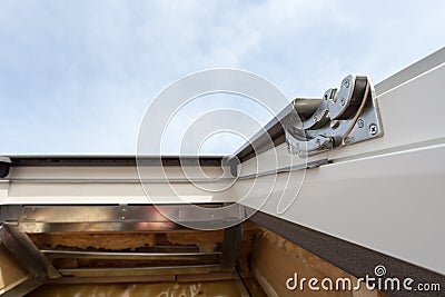 Closeup of element in plastic mansard or skylight window on a asphalt shingle roof. Stock Photo