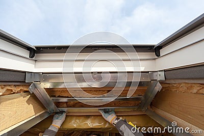 Closeup of element in plastic mansard or skylight window on a asphalt shingle roof. Stock Photo