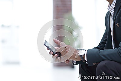 Closeup. employee typing SMS on the smartphone Stock Photo