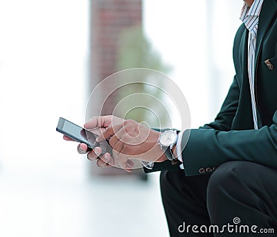 Closeup. employee typing SMS on the smartphone Stock Photo