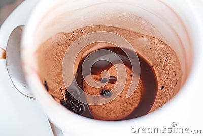Closeup of empty of coffee cup with coffee stains. Stock Photo