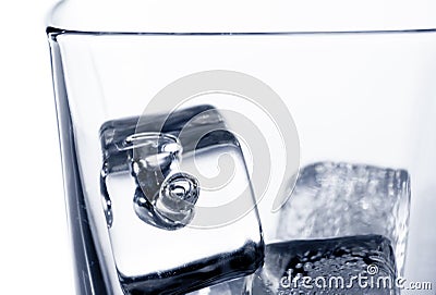 Closeup of empty scotch whiskey in glass with ice cubes on white Stock Photo