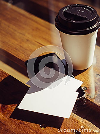 Closeup Empty White Business Card.Mockup.Mobile Phone High Textured Wood Table Take Away Coffee Cup.Work Modern Office Stock Photo