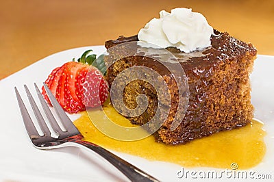 Closeup of english toffee pudding topped with vanilla whipped cream Stock Photo