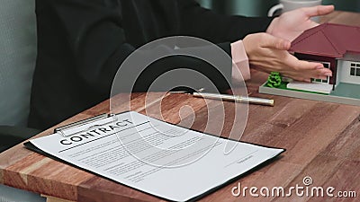 Closeup enthusiastic customer review contract paperwork for house loan. Stock Photo