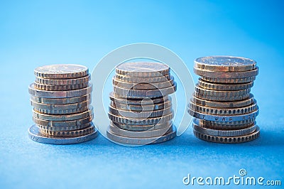 euros coins piles on blue background Stock Photo