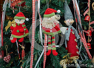 Closeup fabric decorative items hung up Christmas tree Stock Photo