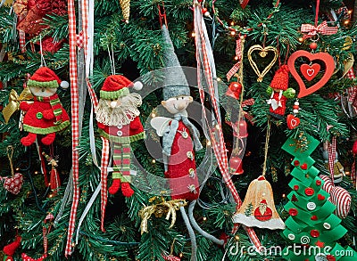 Closeup fabric decorative items hung up Christmas tree Stock Photo