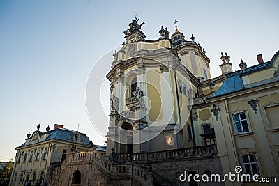 Closeup facade of church of St. Jura with different large sculptures against blue sky Stock Photo