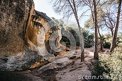 Closeup of a face carved in stone at Ruta de las Caras in Buendia, Cuenca, Spain Editorial Stock Photo