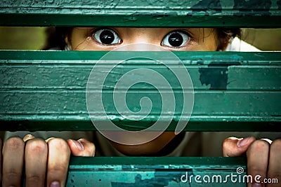 Closeup of face and eyes of sick girl,asian little child sneak peek,peeping spying eyes,suspiciously young woman feeling afraid Stock Photo