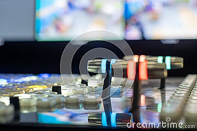 Closeup of fader bars and buttons on a broadcast switcher Stock Photo