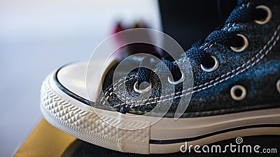 Closeup fashionable sneakers on shop shelf Stock Photo