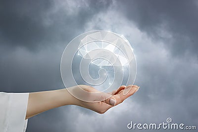 A closeup of female hand with brain model as symbol of mental health Stock Photo