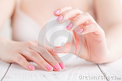 Oseup of a female hand, with a pair of white chicken eggs Stock Photo