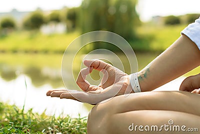 Closeup of the female hand put in gyan mudra. Stock Photo