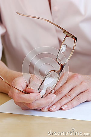 Female hands holding eye glasses Stock Photo