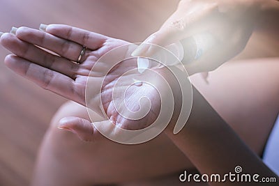 Closeup of female hands testing texture of beauty products Stock Photo