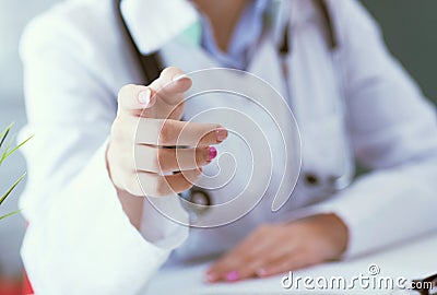 Closeup female health care professional, woman doctor pointing finger, you did something wrong. Stock Photo