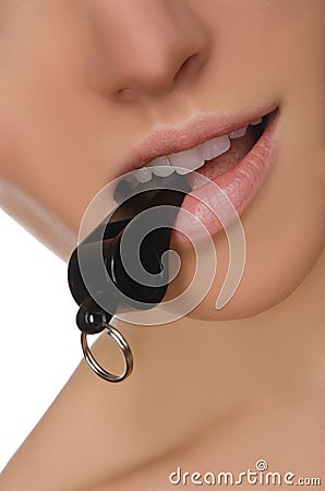 Closeup of female mouth and whistle Stock Photo