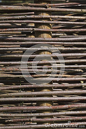Fence made out of branches of a Willow Stock Photo