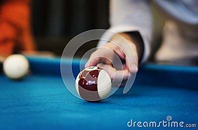 Closeup of finger on billard ball Stock Photo