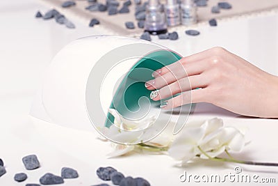 Closeup finger nail care by manicure specialist in beauty salon. Stock Photo