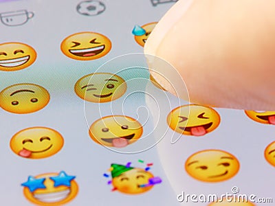 Closeup finger taping icon on screen keyboard Editorial Stock Photo