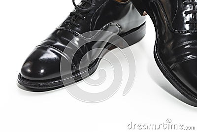 Closeup of Formal Male Stylish Black Polished Oxford Leather Laced Shoes Placed Together Over White Stock Photo