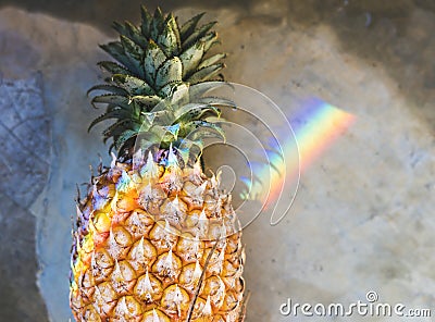 Closeup of fresh pineapple with rainbow prism light Stock Photo