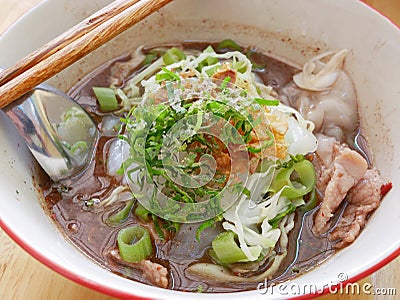 Fresh spicy noodles soup with pork and its tasty made-of-pig-blood thick broth Guay Tiao Rua Stock Photo