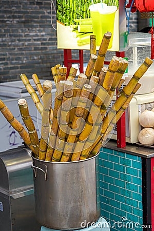 Closeup of freshly squeezed sugarcane juice at a street food stall Stock Photo