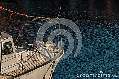 Closeup of a front of a Yacht parked at jetty Stock Photo