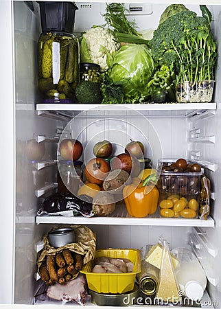 Closeup of full fridge, fresh and colorful vegetables, fruits , dayrt product in the refrigerator, rich nutrition food Stock Photo