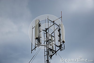 Closeup of a 4g 5g communications mobile tower on top of a hill, antennas for broadcasting signals Stock Photo