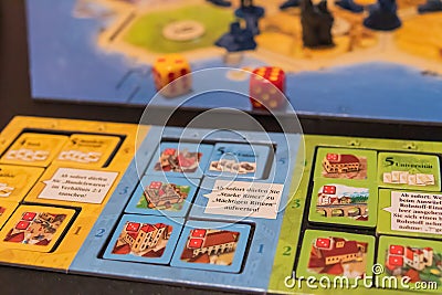 Closeup of a German board game called The Settlers of Catan Editorial Stock Photo