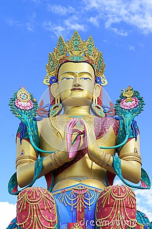 Closeup giant Maitreya Buddha statue with blue sky with clouds. Stock Photo