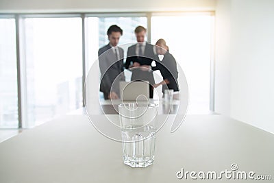 Closeup of a glass of water on office desk Stock Photo