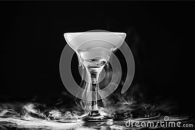 Closeup glass with white fog at dark background. Chemical reaction Stock Photo