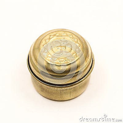 closeup of a golden bronze box jar with hindu om symbol Stock Photo